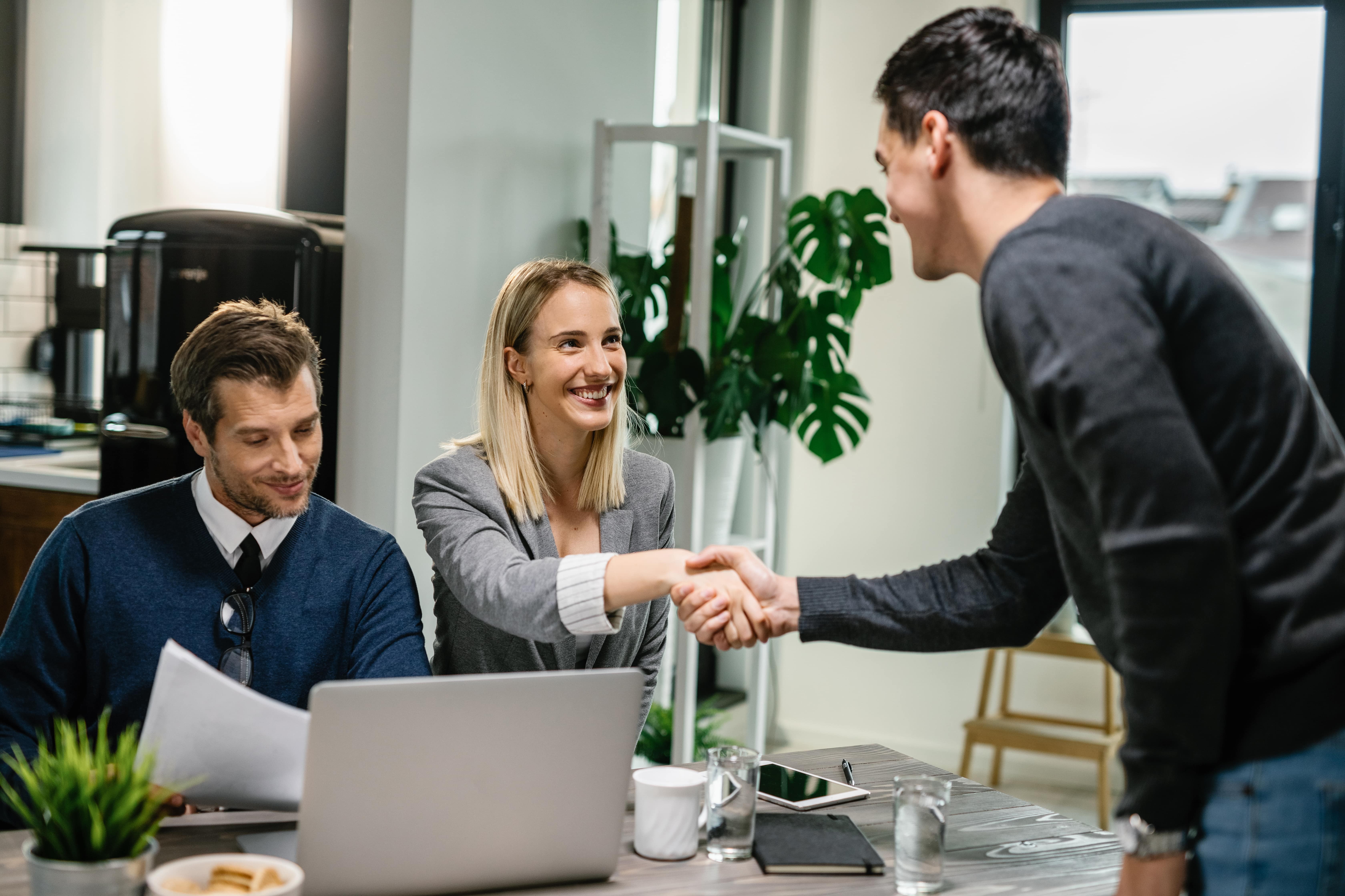 /uploads/images/two-financial-advisors-having-meeting-with-young-man-home-female-advisor-is-shaking-hands-with-client-minjpg-1715416845.jpg